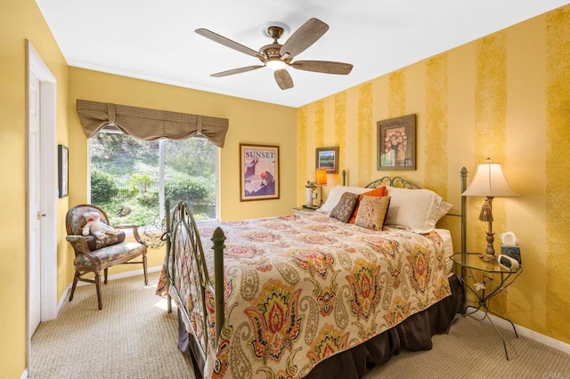 bedroom with carpet, ceiling fan, and baseboards