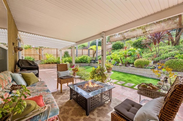 view of patio featuring an outdoor living space with a fire pit, a fenced backyard, and a pergola