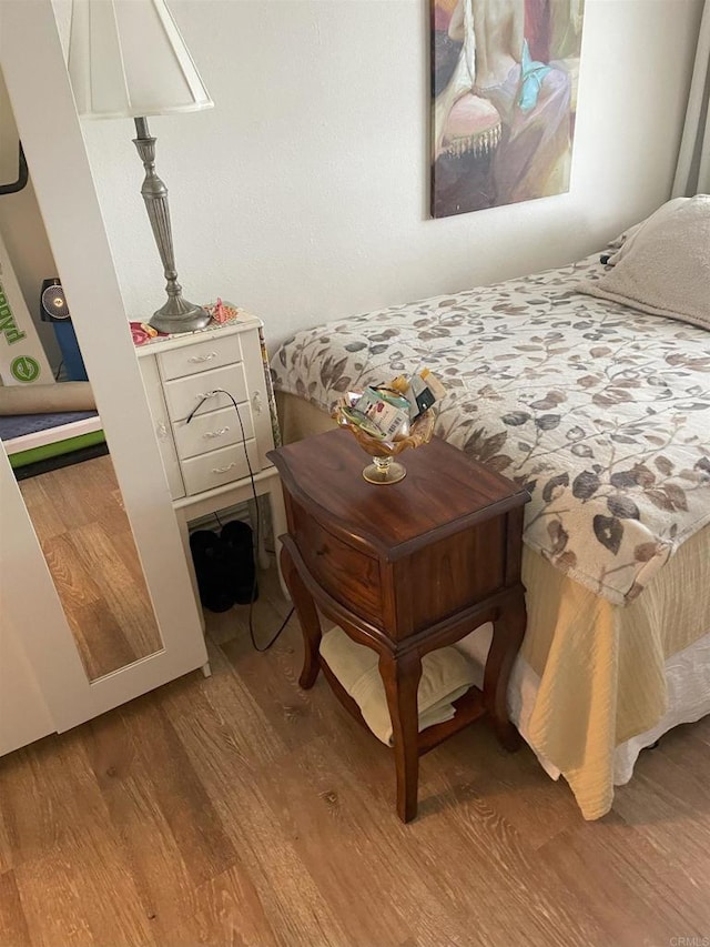 bedroom featuring wood finished floors