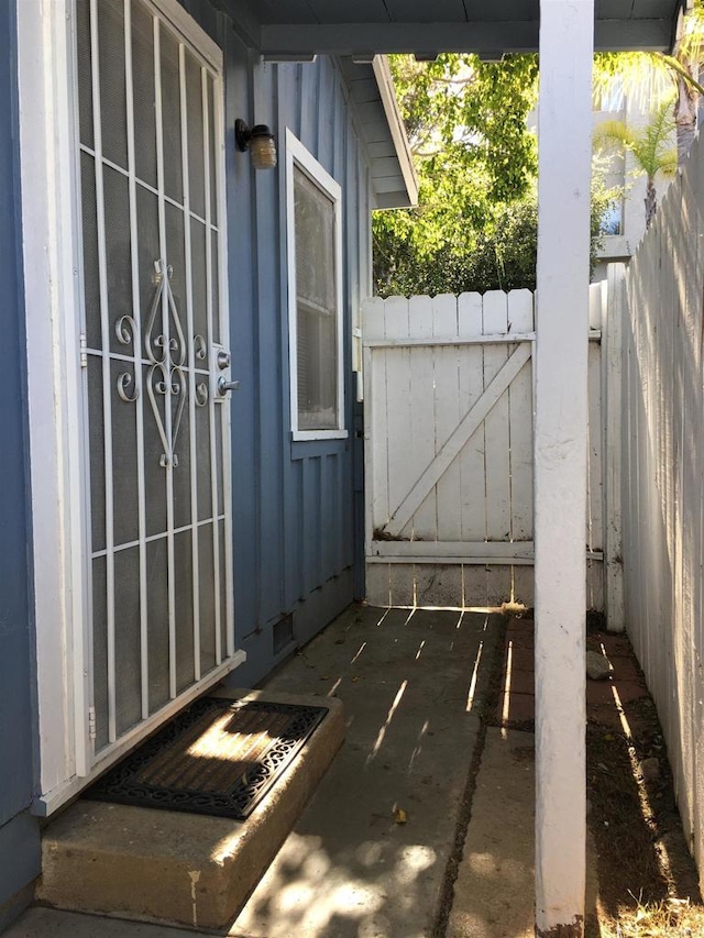 view of patio featuring fence