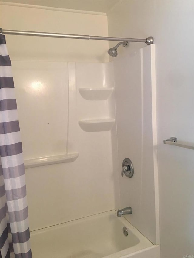 full bath with shower / bathtub combination with curtain