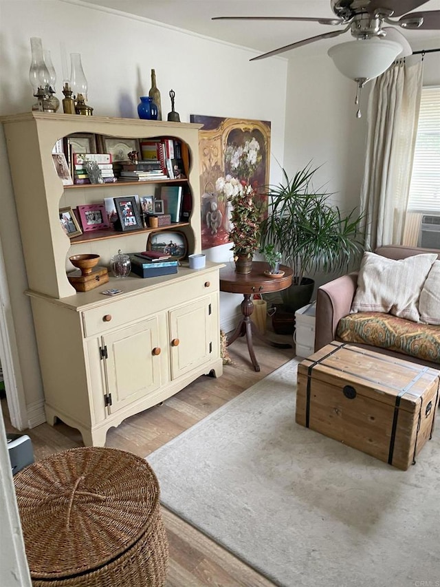 sitting room featuring light wood-style floors and ceiling fan