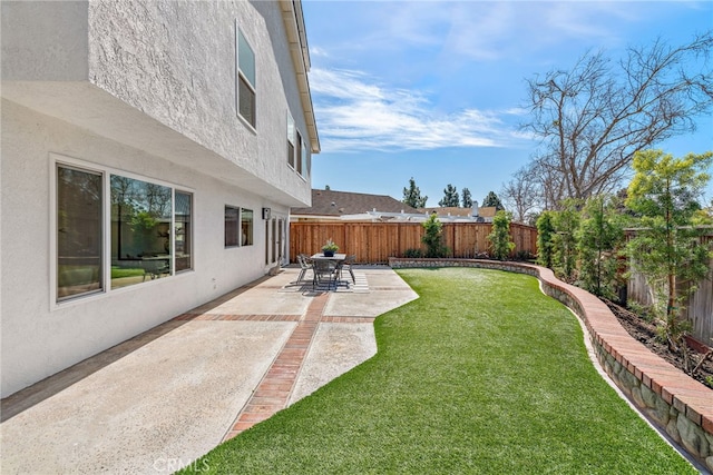 view of yard with a fenced backyard and a patio