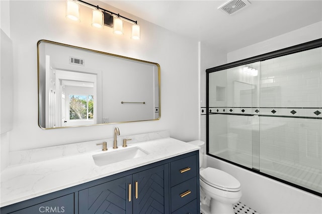 full bath featuring toilet, vanity, visible vents, and enclosed tub / shower combo