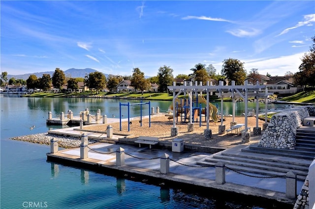 dock area with playground community and a water and mountain view