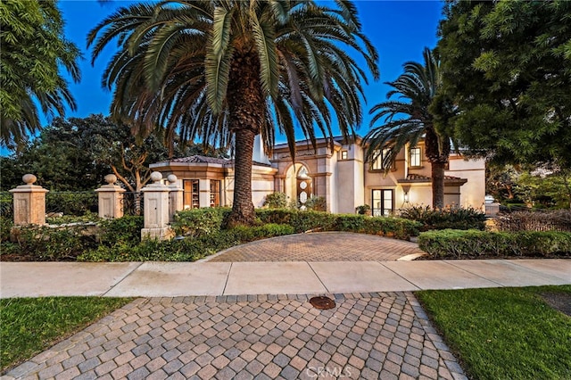 mediterranean / spanish house with stucco siding