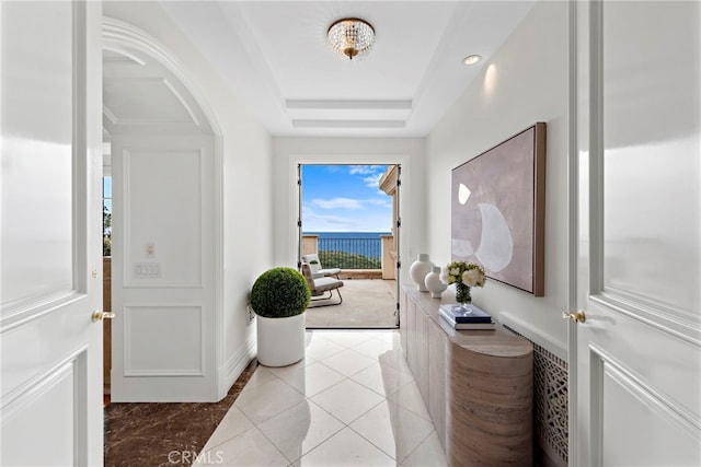 50 Pelican Crest Dr, Newport Coast, CA 92657 - entrance foyer with a tray ceiling, light tile patterned flooring, and baseboards