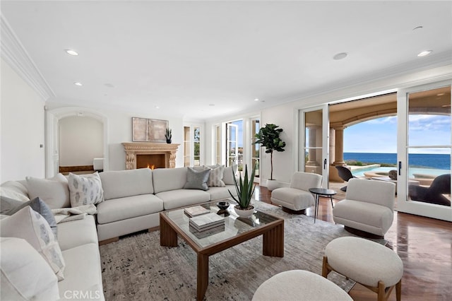 50 Pelican Crest Dr, Newport Coast, CA 92657 - living room featuring a warm lit fireplace, crown molding, and a healthy amount of sunlight