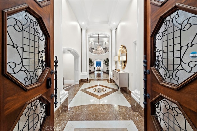 50 Pelican Crest Dr, Newport Coast, CA 92657 - entryway with arched walkways, recessed lighting, crown molding, a notable chandelier, and ornate columns