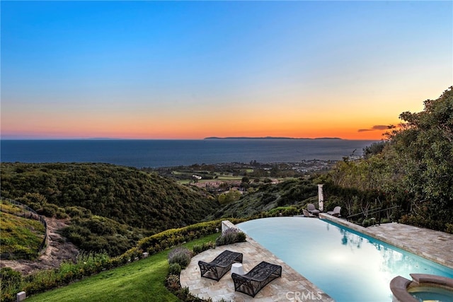 50 Pelican Crest Dr, Newport Coast, CA 92657 - pool at dusk featuring a patio area