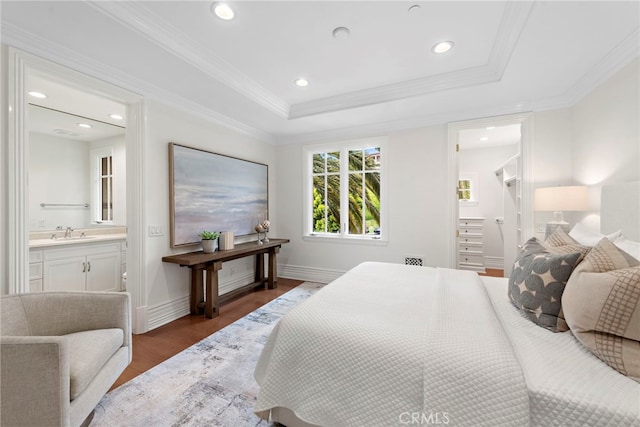 50 Pelican Crest Dr, Newport Coast, CA 92657 - bedroom featuring baseboards, wood finished floors, a tray ceiling, crown molding, and a sink