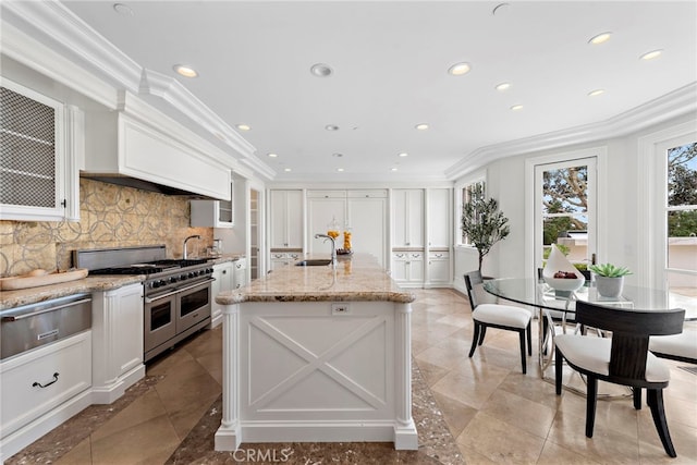 50 Pelican Crest Dr, Newport Coast, CA 92657 - kitchen featuring crown molding, a warming drawer, white cabinets, a sink, and double oven range