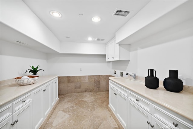 50 Pelican Crest Dr, Newport Coast, CA 92657 - interior space featuring light countertops, a sink, visible vents, and white cabinets