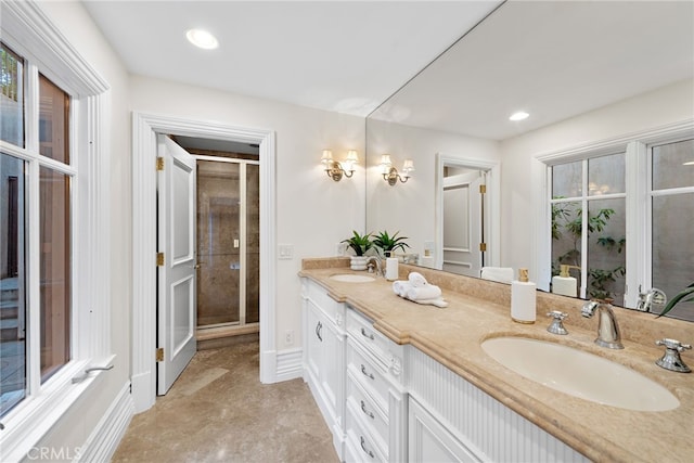 50 Pelican Crest Dr, Newport Coast, CA 92657 - full bathroom featuring double vanity, a stall shower, baseboards, and a sink