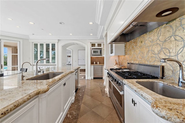 50 Pelican Crest Dr, Newport Coast, CA 92657 - kitchen featuring appliances with stainless steel finishes, extractor fan, a sink, and white cabinets