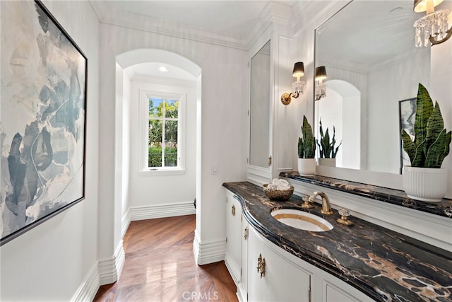 50 Pelican Crest Dr, Newport Coast, CA 92657 - bathroom featuring baseboards, ornamental molding, wood finished floors, and vanity