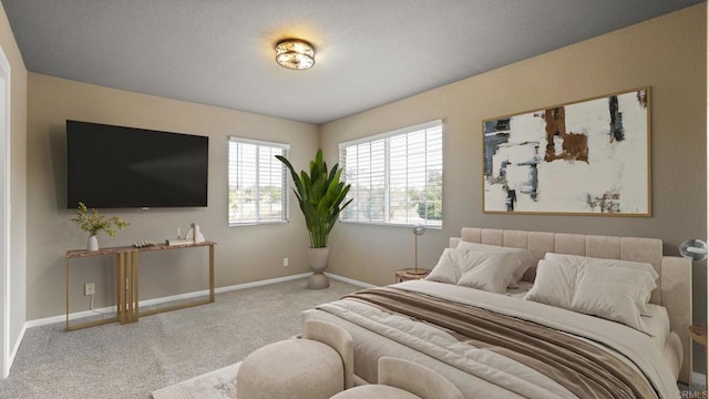 carpeted bedroom featuring baseboards