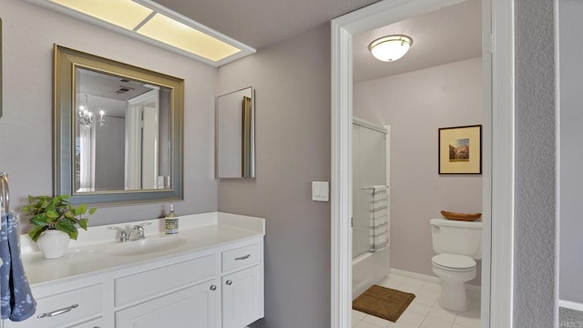 full bath featuring tile patterned flooring, toilet, bathing tub / shower combination, vanity, and baseboards