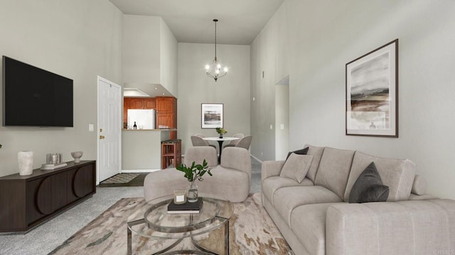 living area featuring carpet floors, an inviting chandelier, and a high ceiling