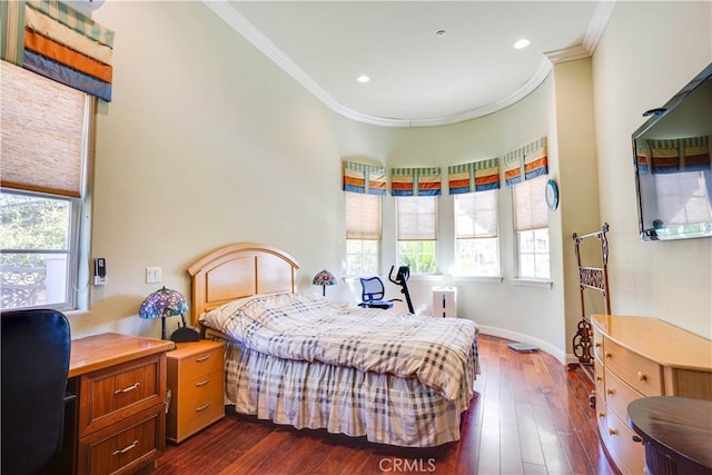 bedroom featuring multiple windows, dark wood-style flooring, and crown molding