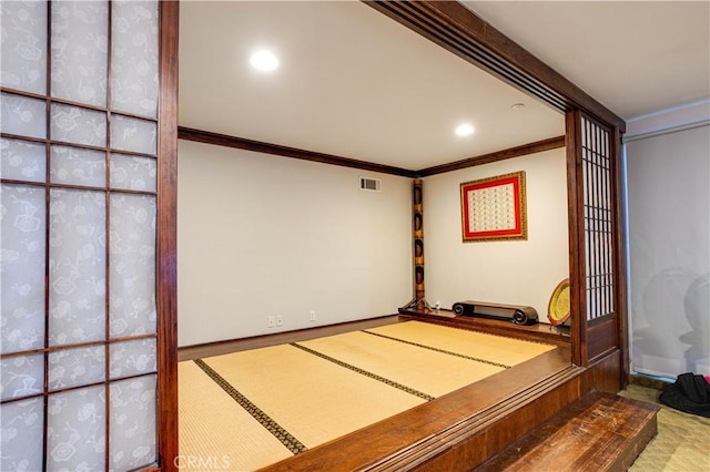 unfurnished bedroom featuring ornamental molding, visible vents, and recessed lighting