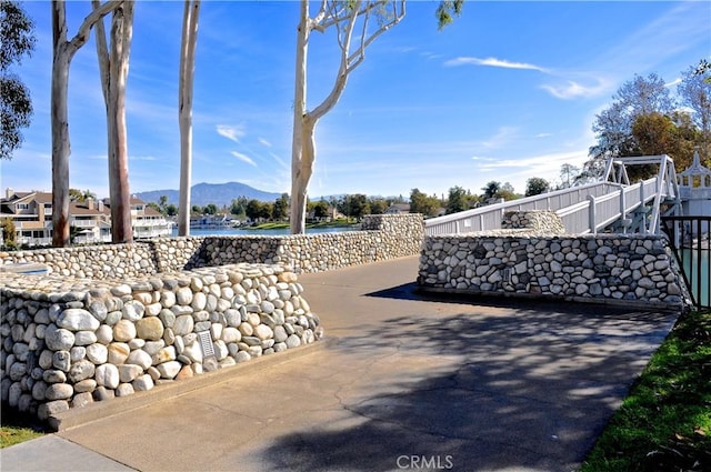 exterior space featuring a mountain view and fence