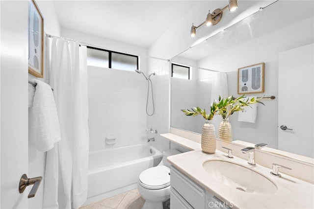 bathroom with toilet, vanity, shower / bath combo with shower curtain, and tile patterned floors