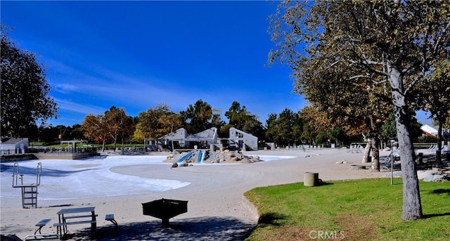 view of home's community featuring playground community