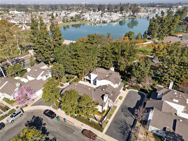 bird's eye view featuring a residential view and a water view