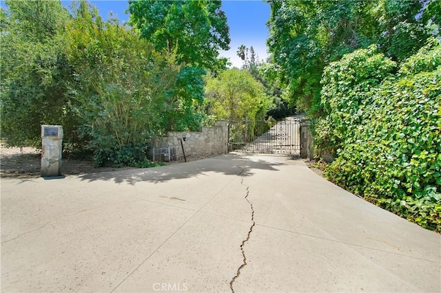 view of road featuring a gate