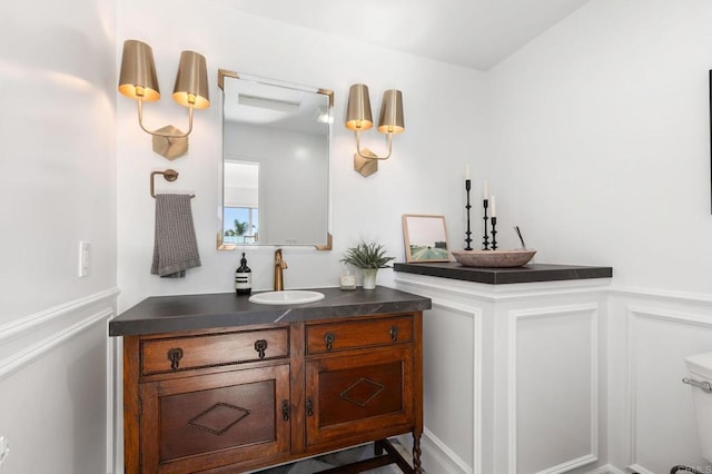 bathroom featuring vanity and toilet