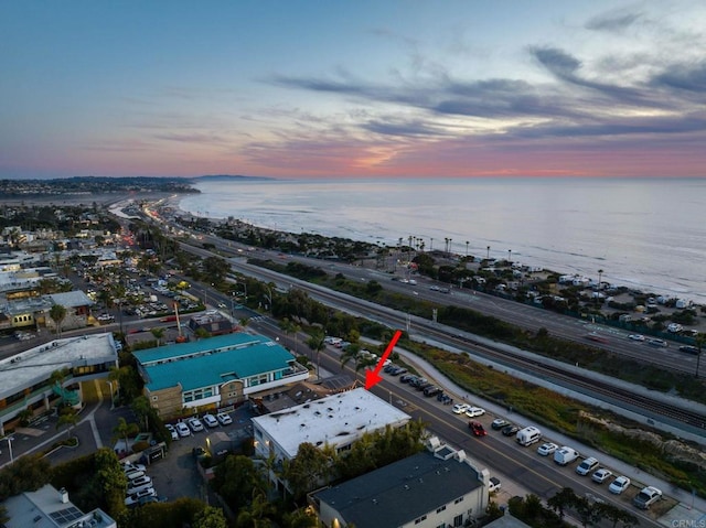 aerial view at dusk with a water view