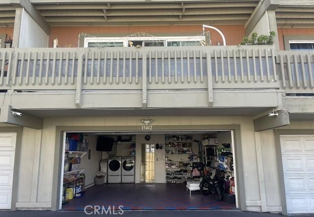 exterior space featuring separate washer and dryer