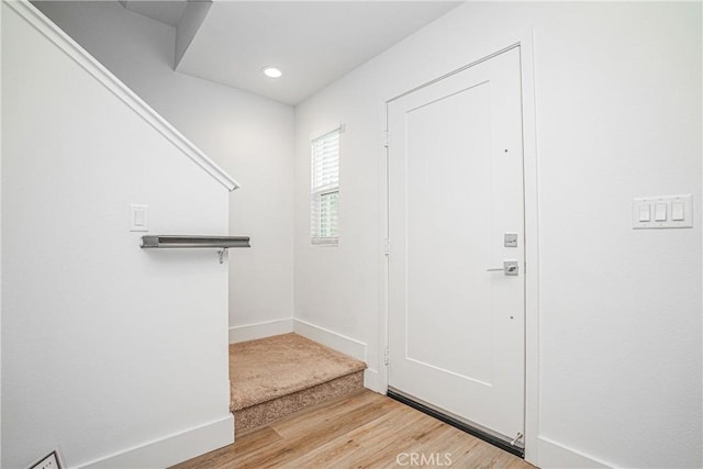 entrance foyer featuring recessed lighting, baseboards, and wood finished floors