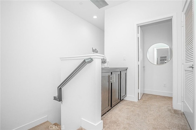 interior space with light carpet, baseboards, visible vents, and recessed lighting