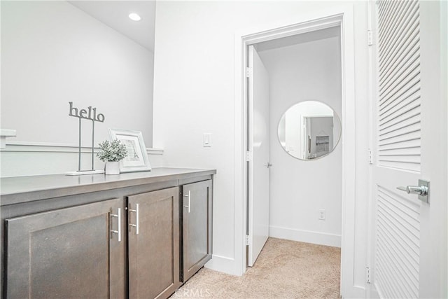 bathroom with baseboards and recessed lighting