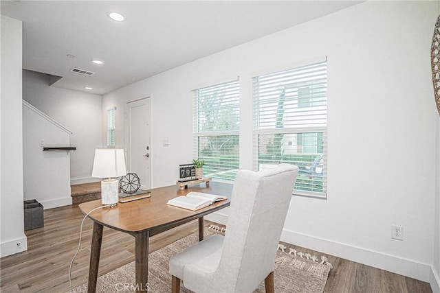 office area with baseboards, visible vents, wood finished floors, and recessed lighting