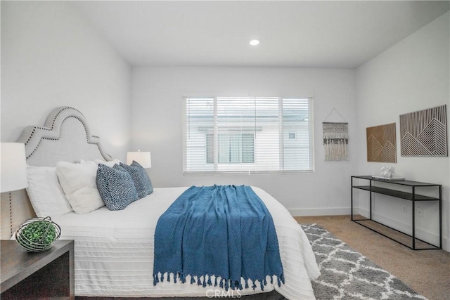 carpeted bedroom with baseboards