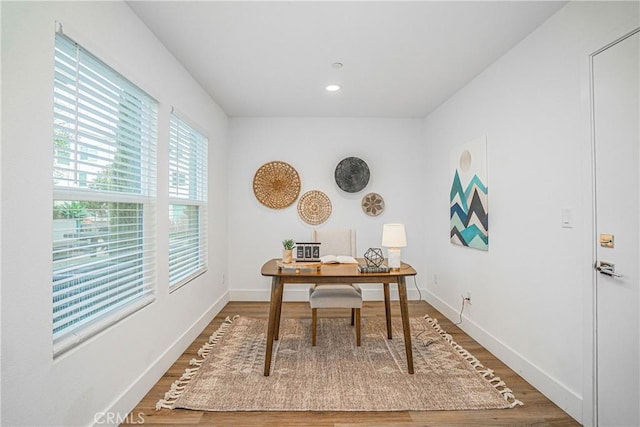 office area featuring baseboards, wood finished floors, and recessed lighting