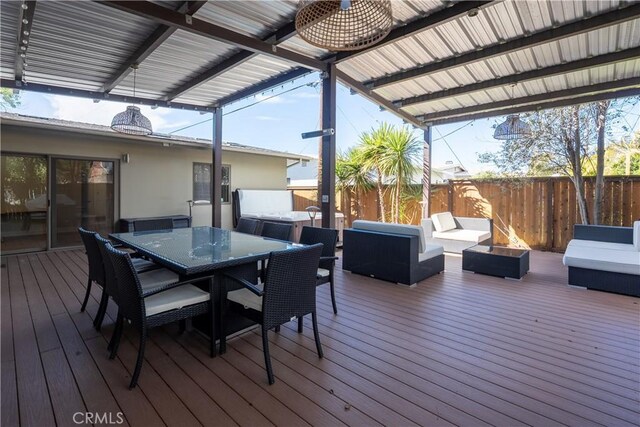 deck featuring an outdoor living space, a fenced backyard, and outdoor dining space