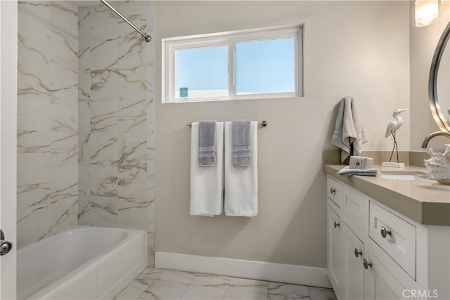 bathroom with baseboards, marble finish floor, tub / shower combination, and vanity