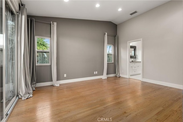 unfurnished bedroom featuring visible vents, baseboards, light wood finished floors, ensuite bathroom, and recessed lighting