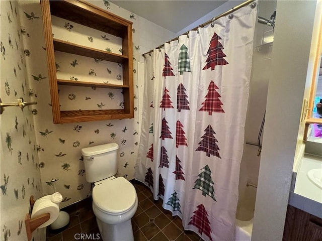 full bath with toilet and tile patterned floors