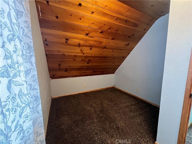 additional living space featuring lofted ceiling, wood ceiling, carpet flooring, and baseboards