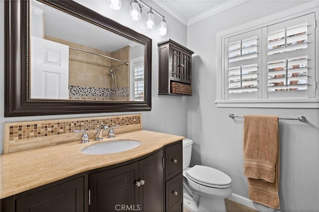 full bath featuring backsplash, walk in shower, toilet, ornamental molding, and vanity