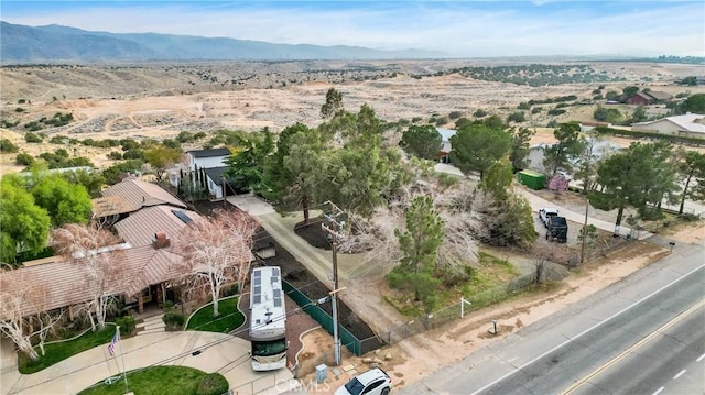 birds eye view of property featuring a mountain view