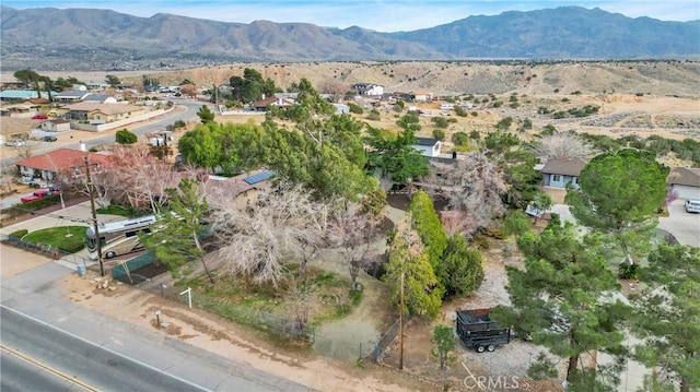 birds eye view of property with a mountain view