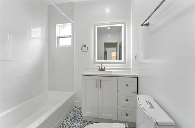 full bath featuring shower / bath combination, vanity, and toilet