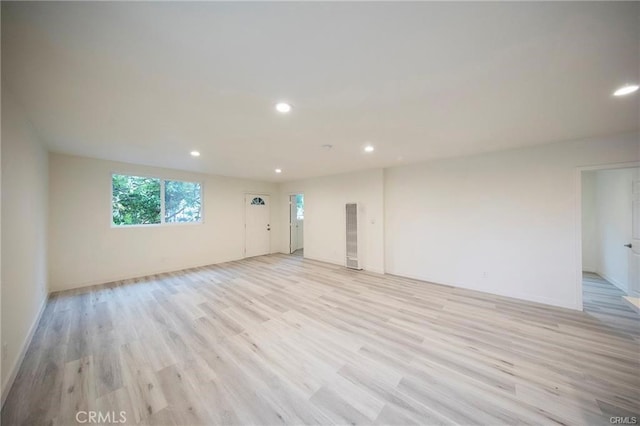 unfurnished room featuring light wood-type flooring and recessed lighting