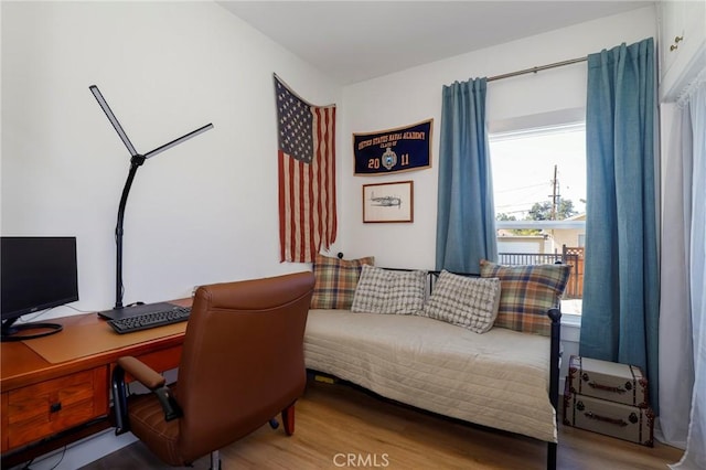 home office with wood finished floors